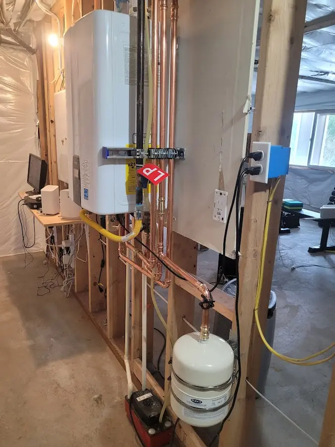 Licensed plumber repairing a kitchen sink in Allen